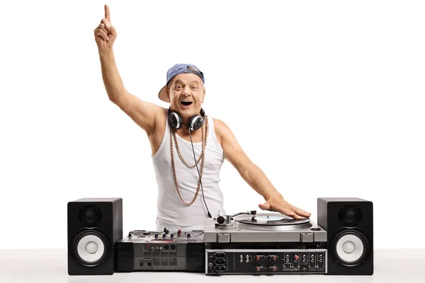 Cheerful DJ playing music on a turntable — Stock Photo, Image