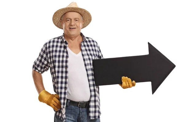 Elderly farmer holding an arrow — Stock Photo, Image