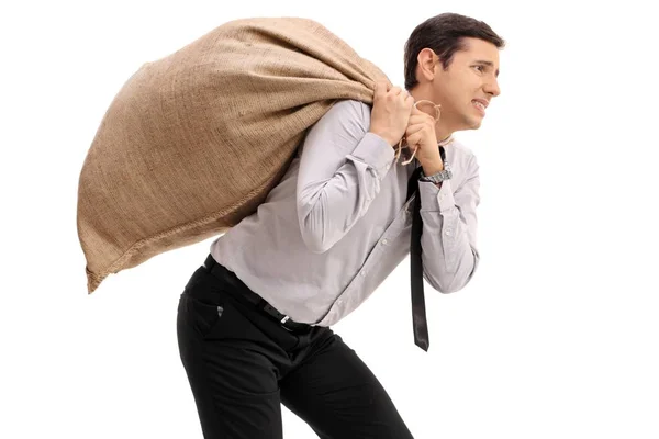 Affärsman bära en säckväv säck på ryggen — Stockfoto