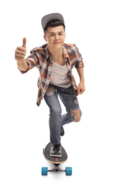 Hipster riding a longboard and making a thumb up gesture — Stock Photo, Image