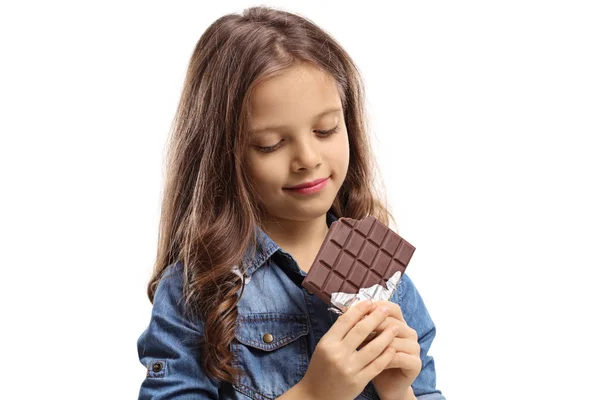 Girl with a chocolate bar — Stock Photo, Image