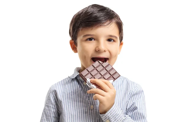 Little boy eating chocolate — Stock Photo, Image