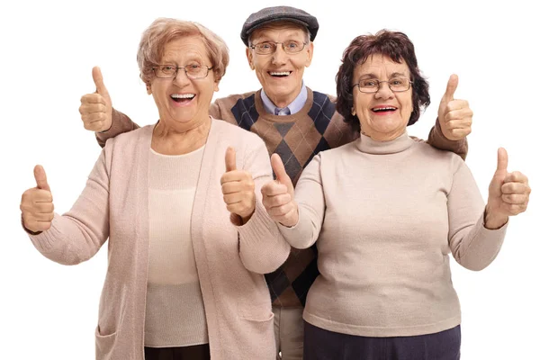 Joyful seniors holding their thumbs up — Stock Photo, Image