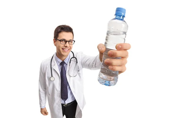 Doctor showing a bottle of water — Stock Photo, Image