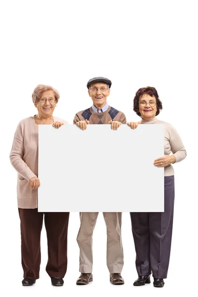 Seniors holding a blank signboard — Stock Photo, Image