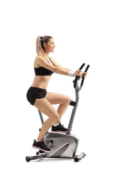 Full Length Profile Shot Young Woman Exercising Cross Trainer Machine — Stock Photo, Image