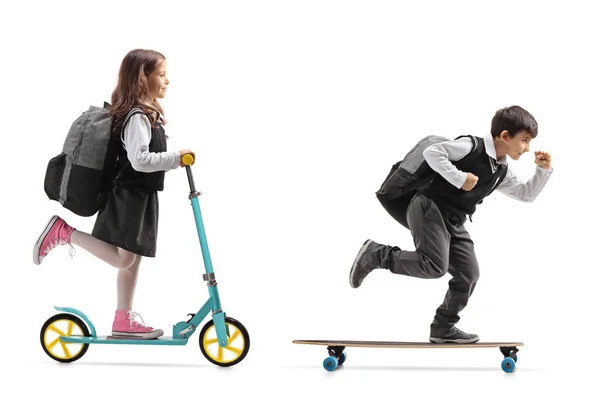 Full Length Profile Shot Schoolgirl Riding Scooter Schoolboy Riding Longboard — Stock Photo, Image