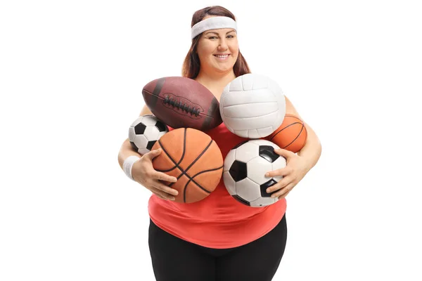 Mujer Con Sobrepeso Sosteniendo Diferentes Tipos Bolas Deportivas Aisladas Sobre — Foto de Stock