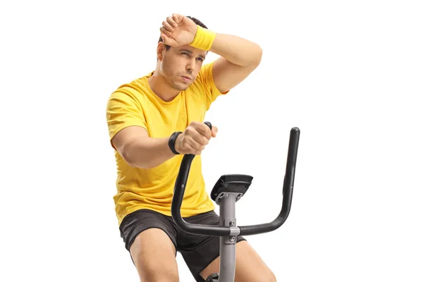 Tired Young Man Exercising Cross Trainer Machine Isolated White Background — Stock Photo, Image