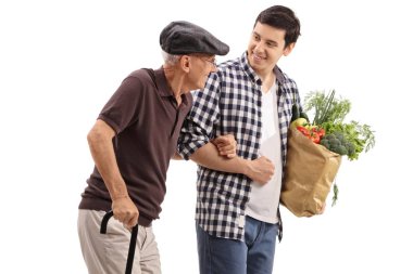Young guy helping an elderly man with his groceries isolated on white background clipart