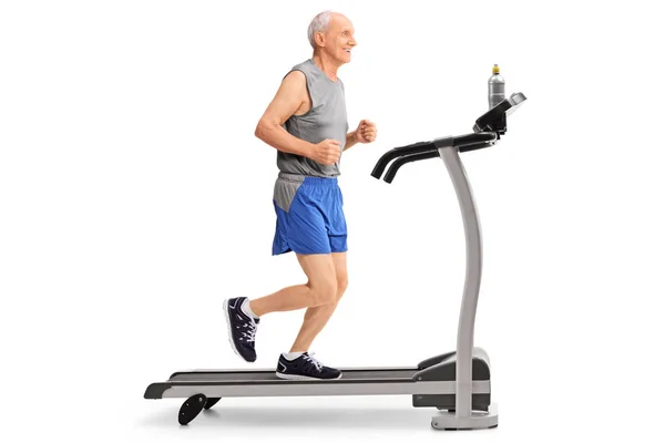 Full Length Profile Shot Senior Running Treadmill Isolated White Background — Stock Photo, Image