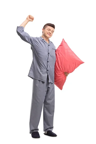 Full Length Portrait Teenage Boy Pajamas Holding Pillow Stretching Himself — Stock Photo, Image