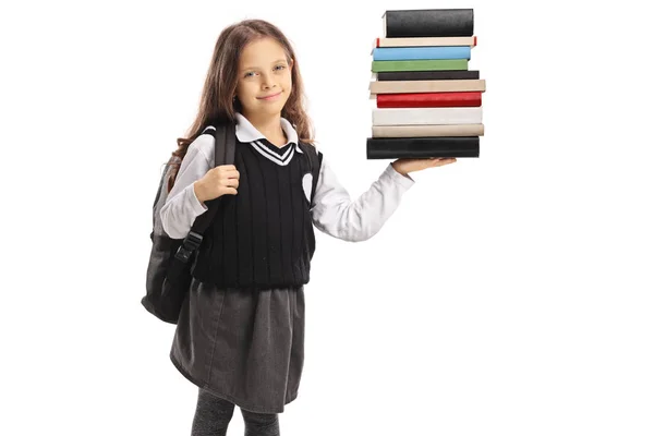 Pequena Estudante Segurando Uma Pilha Livros Isolados Fundo Branco — Fotografia de Stock