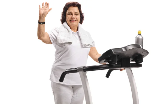 Elderly Woman Treadmill Waving Camera Isolated White Background — Stock Photo, Image