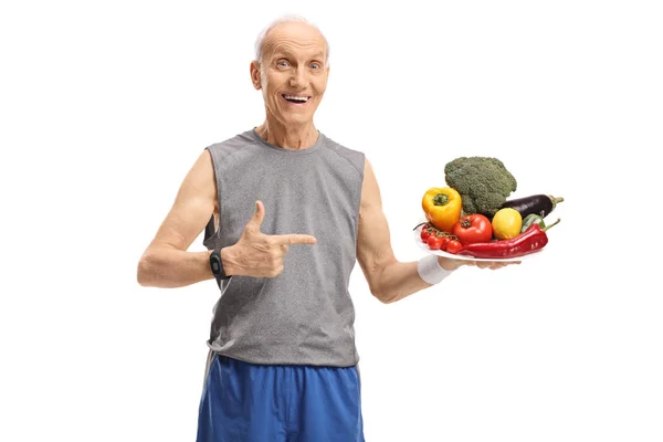 Happy Senior Holding Plate Filled Fruit Vegetables Pointing Isolated White — Stock Photo, Image