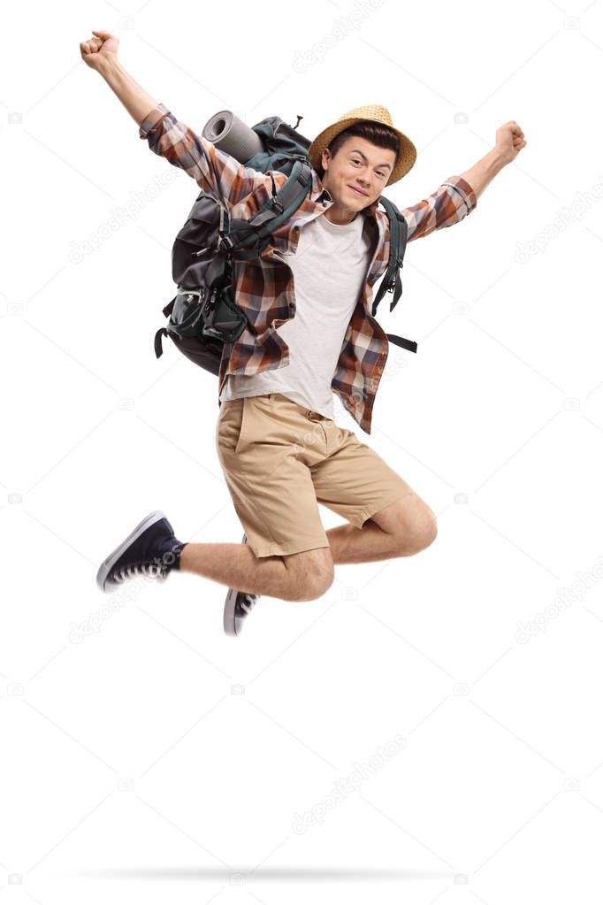Teenage tourist jumping and gesturing happiness isolated on white background