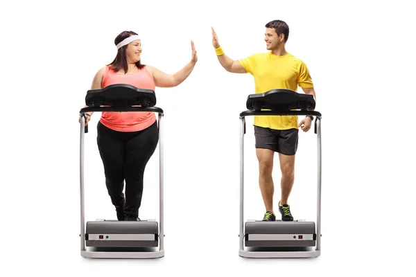 Full Length Profile Shot Overweight Woman Young Man Exercising Treadmills — Stock Photo, Image
