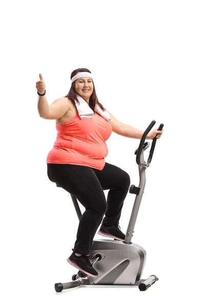 Overweight Woman Exercising Stationary Bike Making Thumb Gesture Isolated White — Stock Photo, Image