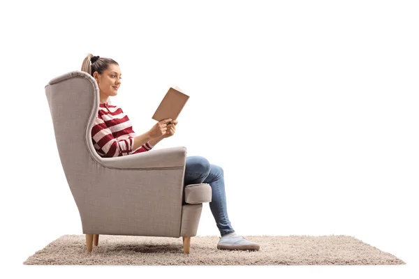 Young Woman Seated Armchair Reading Book Isolated White Background — Stock Photo, Image