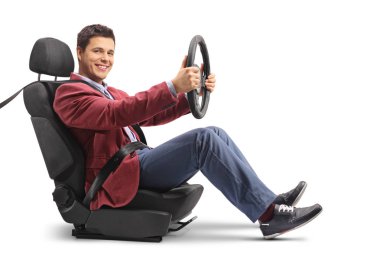 Elegantly dressed man in a car seat driving and looking at the camera isolated on white background clipart