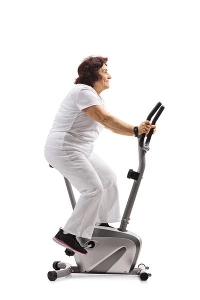 Elderly Woman Working Out Stationary Bike Isolated White Background — Stock Photo, Image