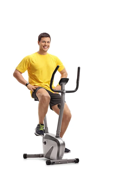 Young Man Working Out Stationary Bike Isolated White Background — Stock Photo, Image