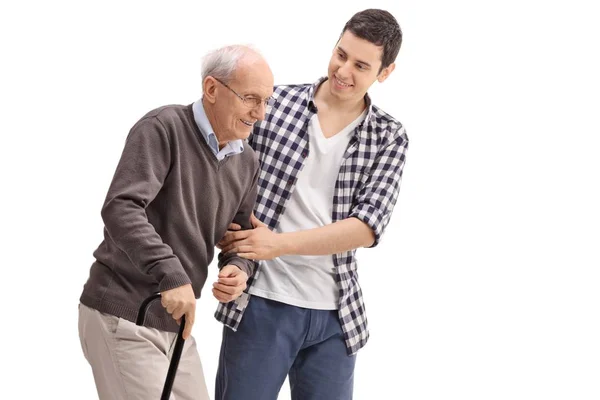 Ung Man Hjälper Senior Isolerad Vit Bakgrund — Stockfoto