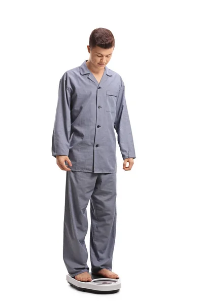 Full Length Portrait Teenage Boy Pajamas Standing Weight Scale Isolated — Stock Photo, Image