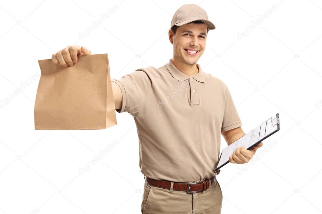 Delivery guy holding a paper bag and a clipboard isolated on white background