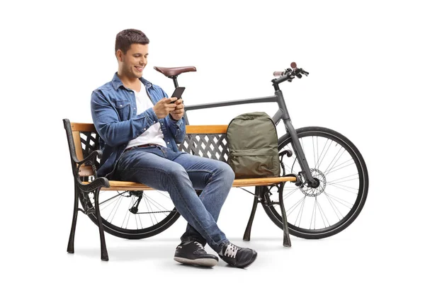 Joven Con Teléfono Bicicleta Sentado Banco Madera Aislado Sobre Fondo — Foto de Stock