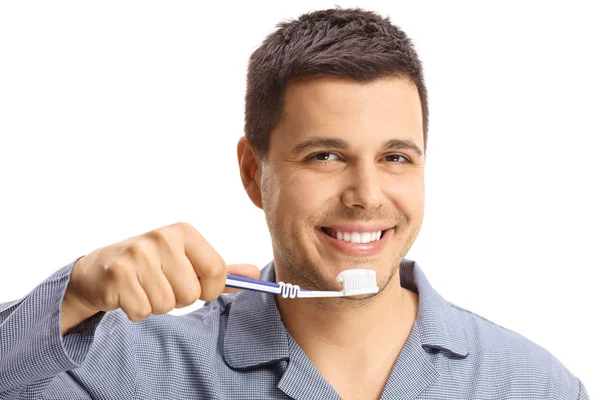 在白色背景下手持牙刷的男子特写 — 图库照片