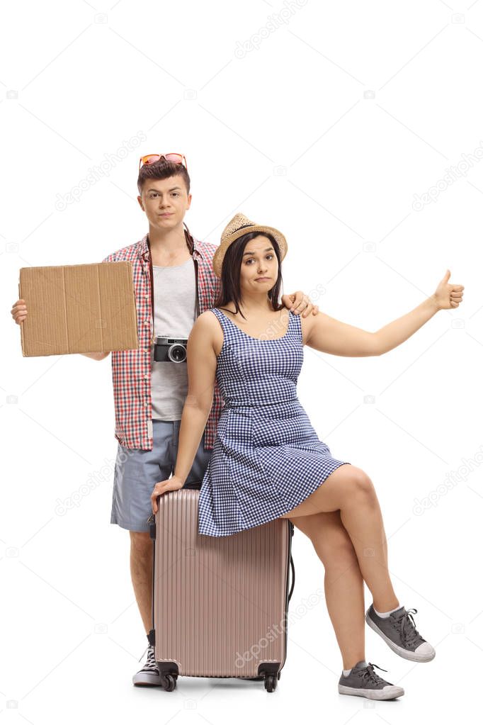 Sad teenage tourists with a blank cardboard sign hitchhiking isolated on white background