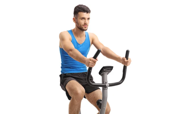 Jonge Man Uit Oefenen Een Upright Bike Geïsoleerd Witte Achtergrond — Stockfoto