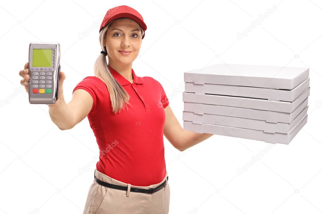 Delivery girl holding a payment terminal and a stack of pizza boxes isolated on white background