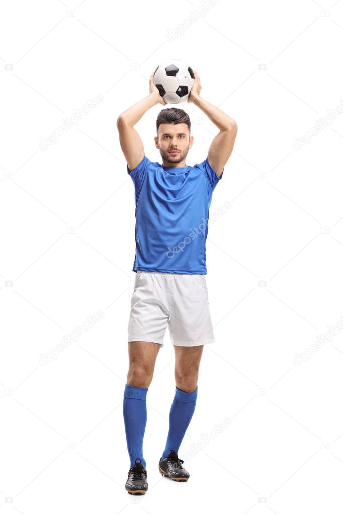 Full length portrait of a soccer player taking a throw-in isolated on white background