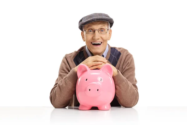 Gelukkig Senior Met Een Spaarpot Zitten Aan Een Tafel Die — Stockfoto