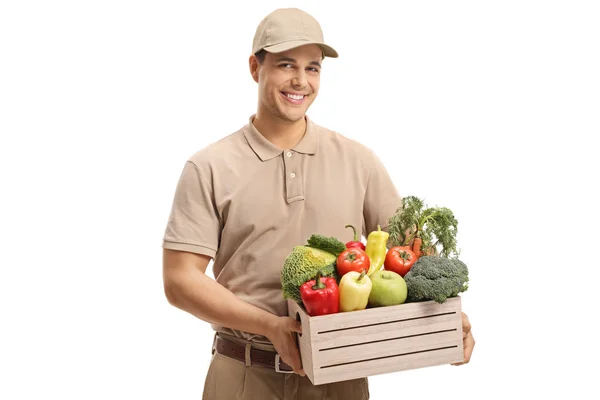 Lieferant Hält Eine Kiste Mit Lebensmitteln Auf Weißem Hintergrund — Stockfoto