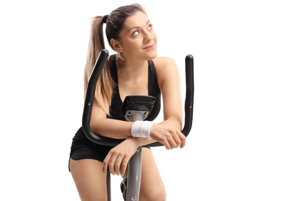 Young Woman Daydreaming Exercise Bike Isolated White Background — Stock Photo, Image
