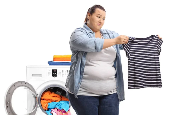 Sad Overweight Woman Holding Shrunken Shirt Front Washing Machine Isolated — Stock Photo, Image