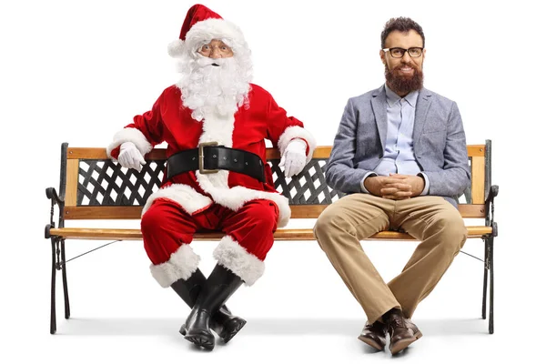 Père Noël et un homme plus jeune assis sur un banc — Photo
