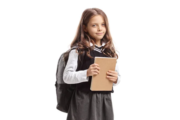 Aranyos iskolás lány kezében egy jegyzetfüzet — Stock Fotó