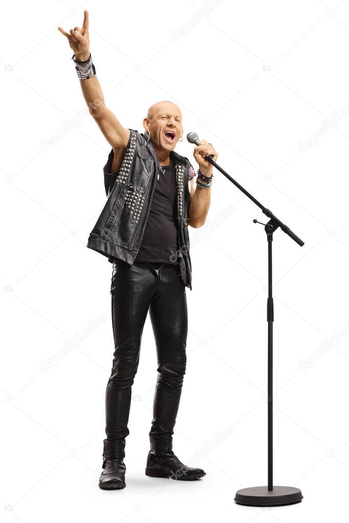 Male rock star singing on a microphone