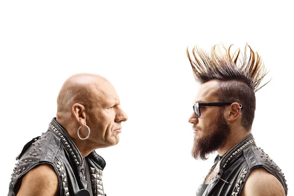 Young punker with a mohawk and an older bald punker looking at e