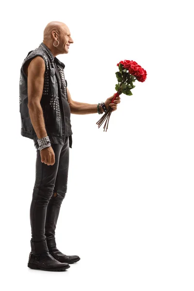 Bald punk giving a bunch of red roses — Stock Photo, Image