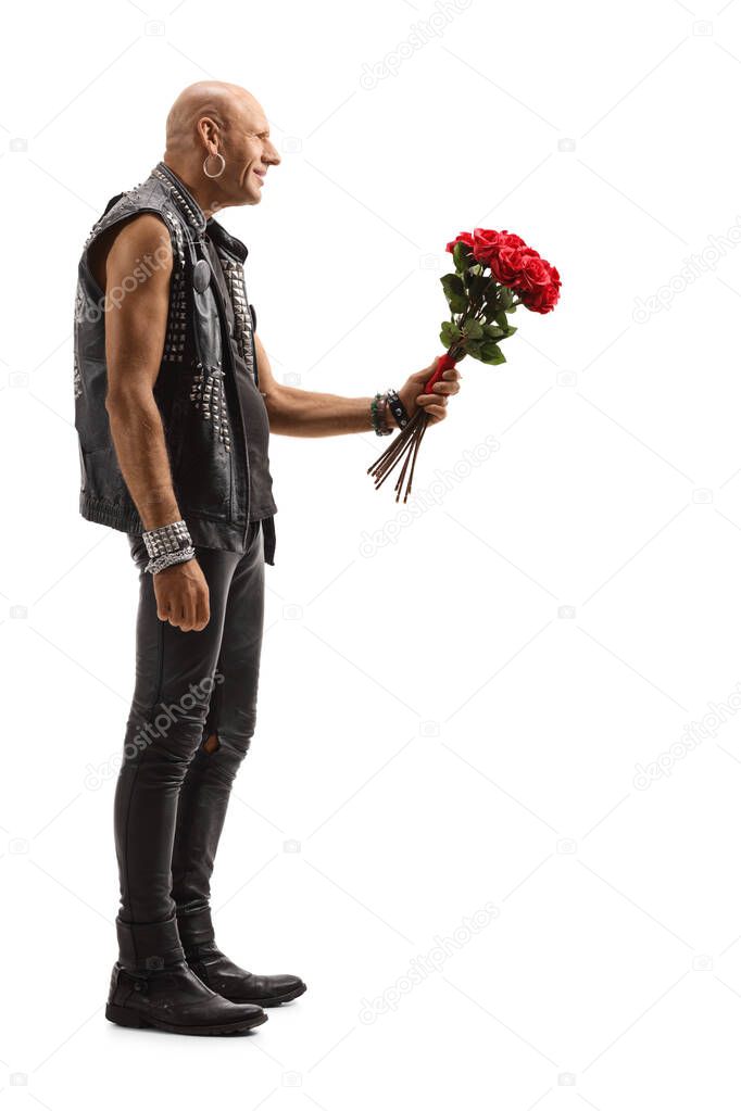 Bald punk giving a bunch of red roses