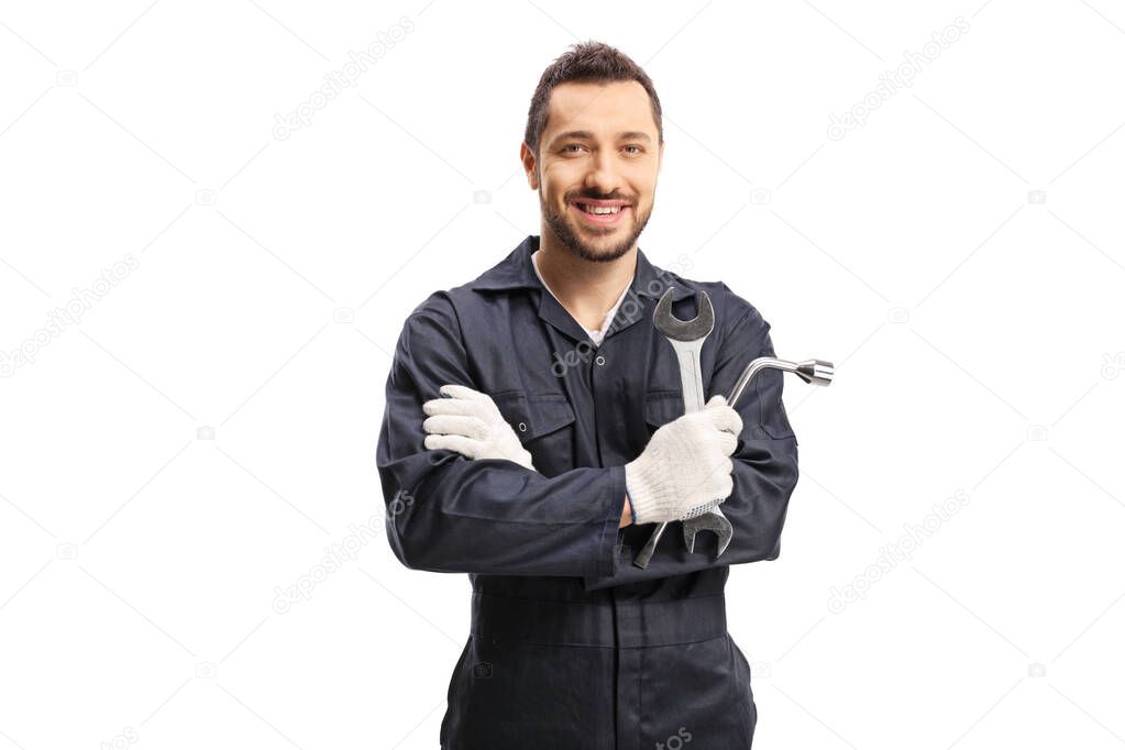 Mechanic holding car repair equipment