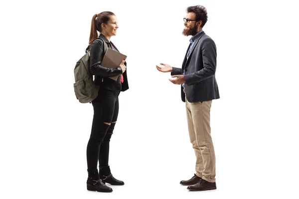 Bearded man talking to a smiling female student — Stock Photo, Image