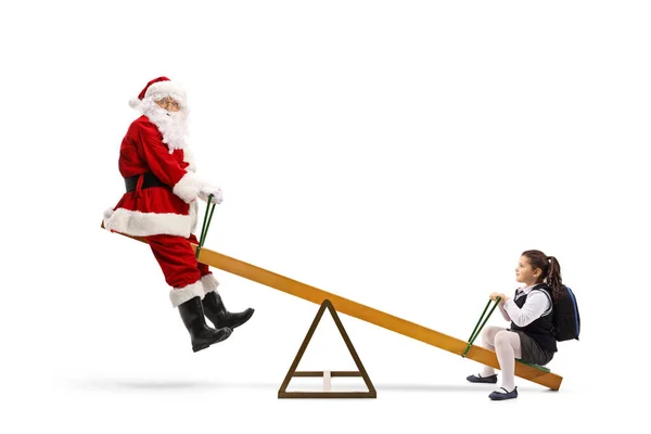 Babbo Natale che gioca su un'altalena con una bambina — Foto Stock