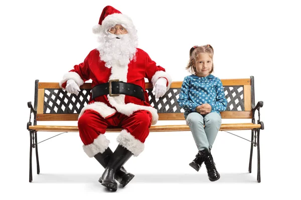 Bambina seduta su una panchina con Babbo Natale — Foto Stock