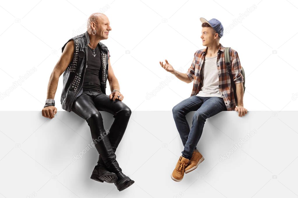 Hardcore punker and a male student talking and sitting on a pane
